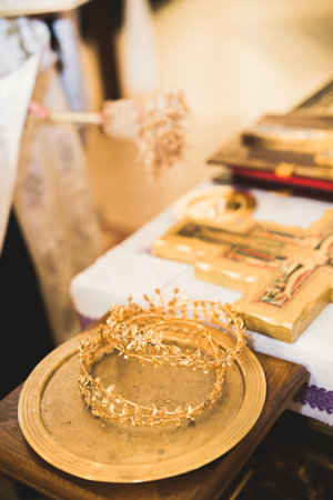 Golden crowns lying on the table in churchの写真素材