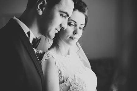 Sensual portrait of a young wedding couple. Outdoorの写真素材