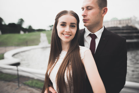 Sensual portrait of a young wedding couple. Outdoorの写真素材