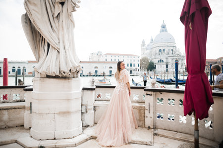 Beautiful fashion bride in wedding dress posingの写真素材