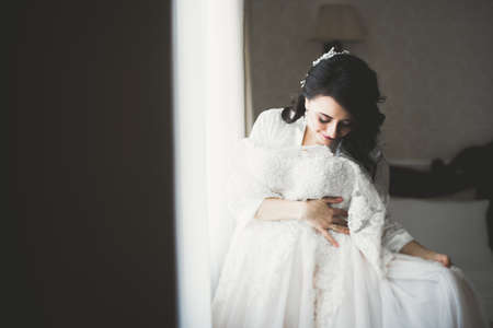 Portrait of beautiful bride with fashion veil at wedding morningの写真素材