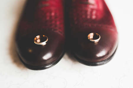 Two golden wedding rings isolated background conceptの写真素材