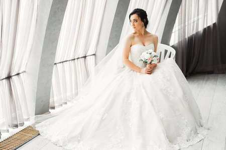 Luxury wedding bride, girl posing and smiling with bouquetの写真素材