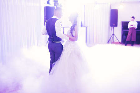 Beautiful wedding couple just married and dancing their first danceの写真素材