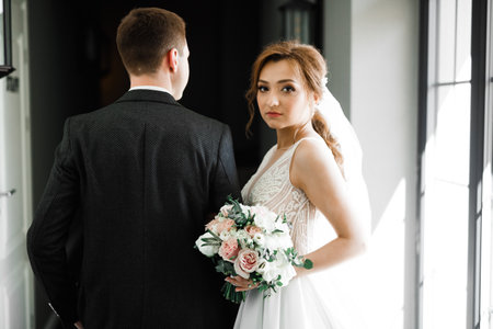 Romantic wedding moment, couple of newlyweds smiling portrait, bride and groom huggingの写真素材
