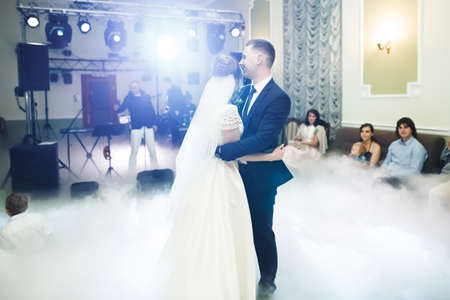 Beautiful wedding couple just married and dancing their first danceの写真素材