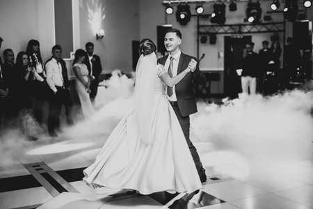Beautiful wedding couple just married and dancing their first danceの写真素材