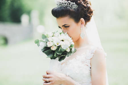 Beautiful fashion bride in wedding dress posingの写真素材