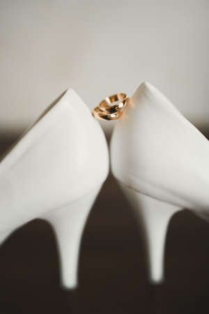 Two golden wedding rings isolated background conceptの写真素材