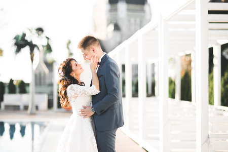 Sensual portrait of a young wedding couple. Outdoorの写真素材