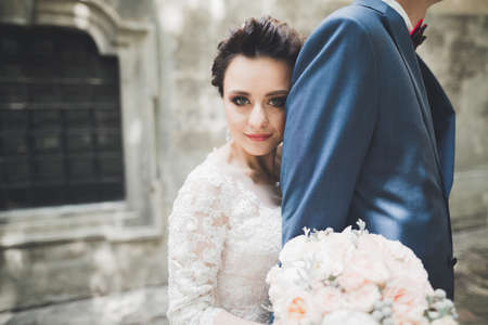 Luxury married wedding couple, bride and groom posing in old cityの写真素材