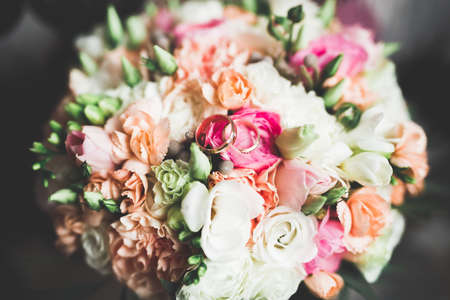 Two golden wedding rings isolated background conceptの写真素材