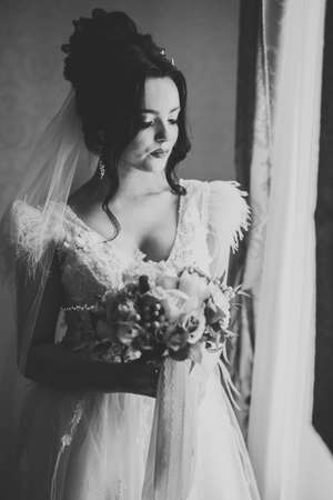 Portrait of stunning bride with long hair posing with great bouquetの写真素材