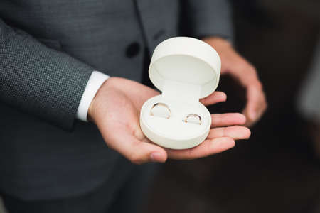 Wedding rings on ceremony at church. Macro.