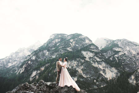 Romantic wedding moment, couple of newlyweds smiling portrait, bride and groom huggingの写真素材