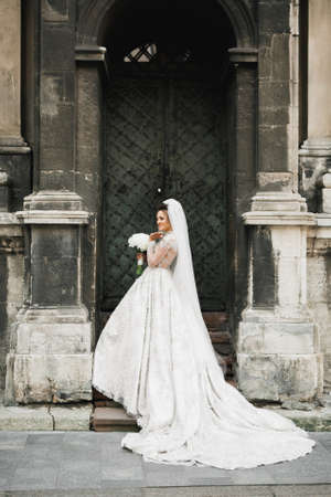 Bride holding big and beautiful wedding bouquet with flowersの写真素材
