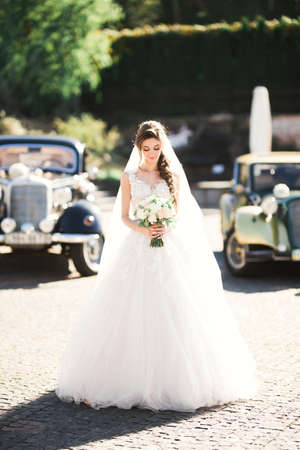 Bride holding big and beautiful wedding bouquet with flowersの写真素材