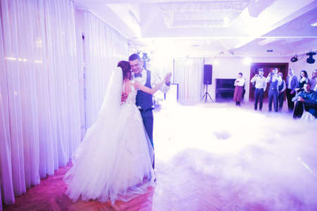 Beautiful wedding couple just married and dancing their first danceの写真素材