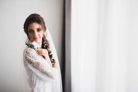 Luxury wedding bride, girl posing and smiling with bouquetの写真素材