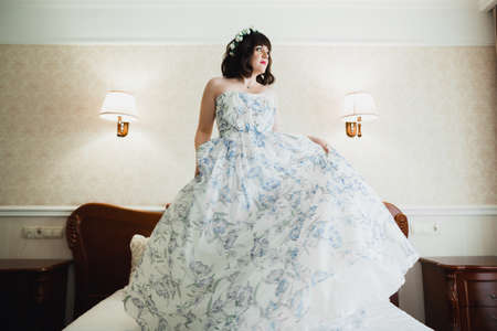 Portrait of beautiful bride with fashion veil at wedding morningの写真素材