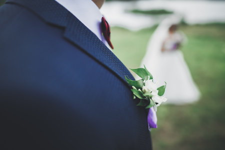 Happy wedding couple walking in a botanical park
