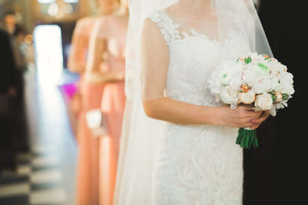 Wedding couple bide and groom get married in a churchの写真素材