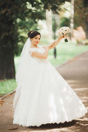 Portrait of stunning bride with long hair posing with great bouquetの写真素材