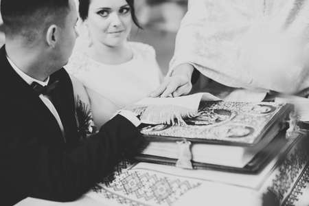 Wedding couple bide and groom get married in a churchの写真素材