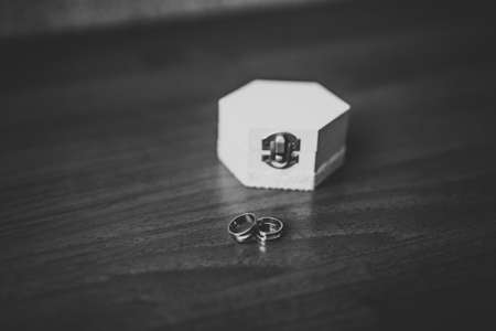 Two golden wedding rings isolated background conceptの写真素材