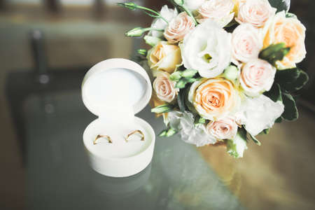 Two golden wedding rings isolated background conceptの写真素材