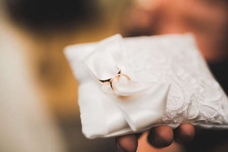Wedding rings on ceremony at church. Macro.の写真素材