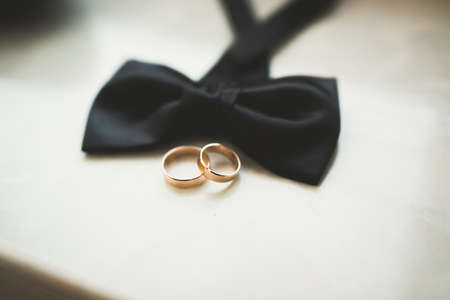 Two golden wedding rings isolated background conceptの写真素材