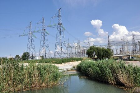 Power transmission lines on the background of the blue sky
