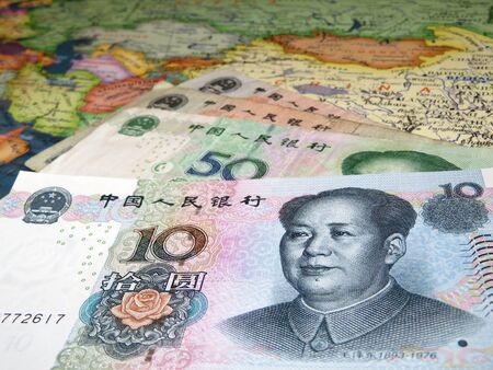Yuan banknotes on the map of Chinaの写真素材