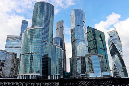 View to skyscrapers of Moscow city from the embankment of the Moscow river. Futuristic city in...