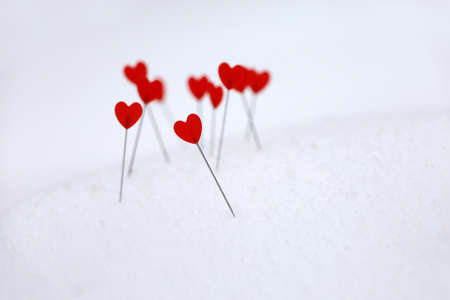 Red hearts on a snow, symbols of love. Background for romantic greeting card, Valentine's dayの写真素材