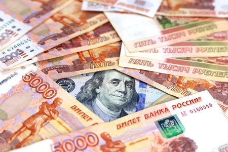Russian rubles and US dollar banknotes. Concept of exchange rate, American sanctions against the...