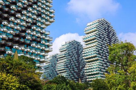 View of grand tree hotel buildings on Linchun river in Sanya, China