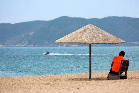 Lifeguard is on duty at the post on sea background. Beach vacation, water safety conceptの写真素材