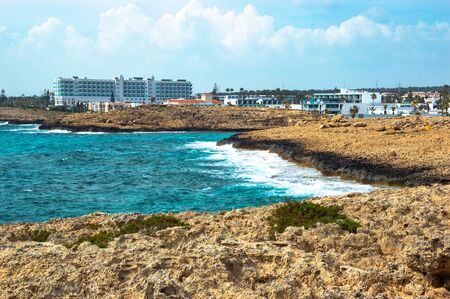 Cyprus. on a rocky Mediterranean coast on a Sunny day. Rocks in the foreground and the turquoise sea to the horizonの写真素材
