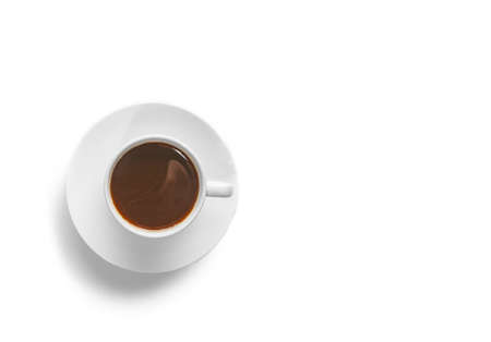small white porcelain cup with hot coffee on a white saucer side view isolated on a white backgroundの写真素材