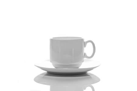 empty small white porcelain coffee cup on a white saucer top view isolated on a white backgroundの写真素材