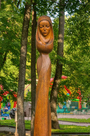 Park of wooden sculptures in Bryansk. Wooden sculpture "Bryansk Madonna" in the public Park-Museum of Alexey Tolstoy. Bryansk, Russia-July 2020のeditorial素材