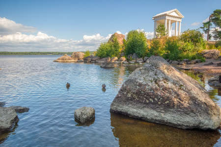 Temple of Neptune in the Park of Monrepos on a warm summer day. A Museum-reserve with Hiking trails, the Monrepos estate and a family cemetery. Vyborg, Russia, August 2019.の写真素材