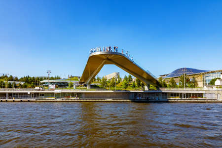 View from the Moskva River to Zaryadye Park with a floating bridge and pier on Moskvoretskaya Embankment - Moscow, Russia, July 2021のeditorial素材