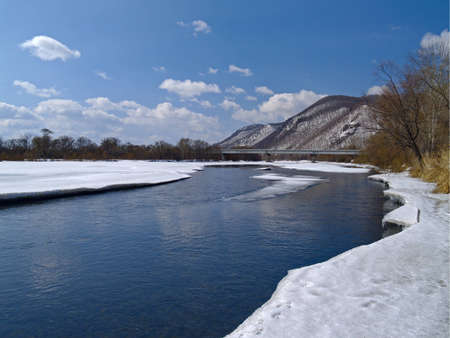 Spring landscape a last ice beside coast riverの写真素材
