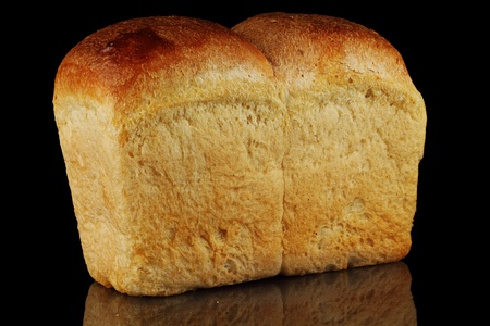 A loaf of bread on a black background.