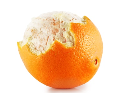 Half-peeled orange on a white background.の写真素材