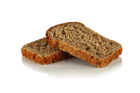 Two slices of bread from sprouted grains of coarse, white background.