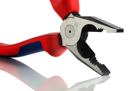 Fragment of new pliers on a white background.の写真素材